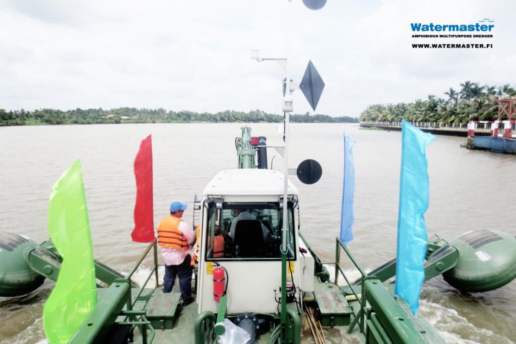 Watermaster, the self-propelled Multipurpose river Maintenance and Cleaning machine cruising to the worksite, Vietnam.