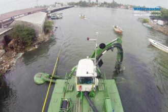 Watermaster dredging to keep the busy Negombo Lagoon clean and navigable, Sri Lanka