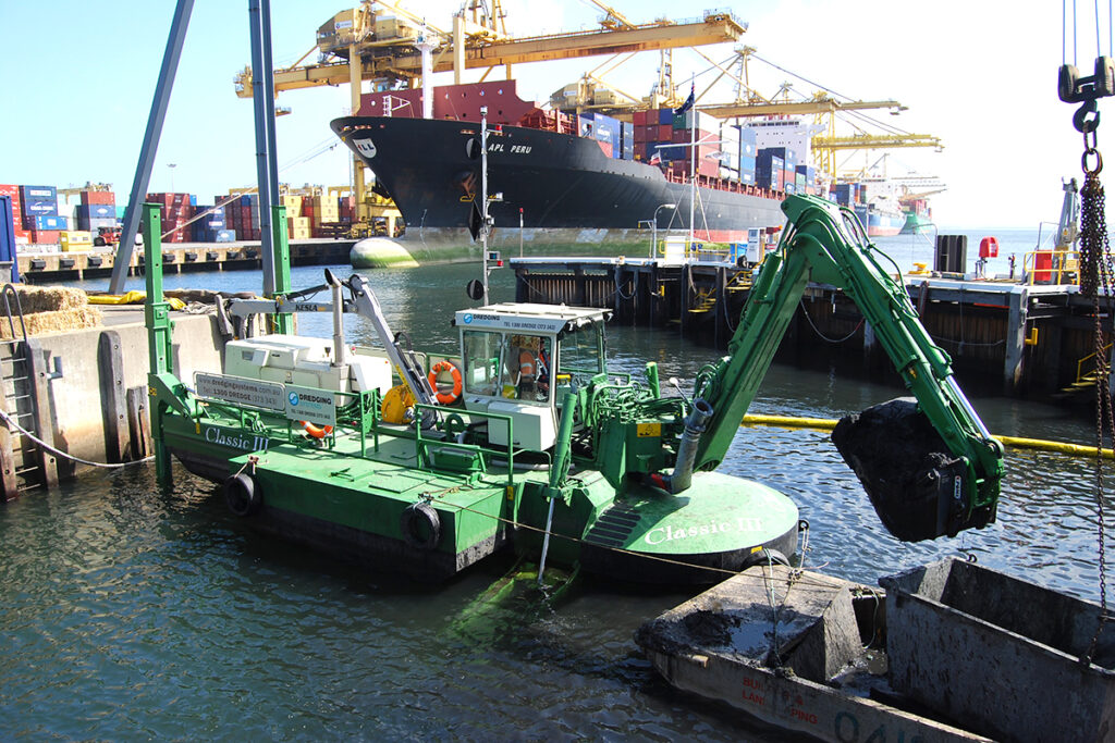 Watermaster maintenance dredging at a harbour
