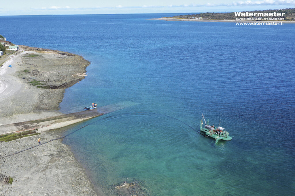 Maintenance dredging a ferry route to ensure its functionality and safety in Chile