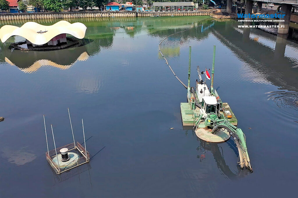 Watermaster dredging accumulated silt from Jakarta's water bodies in Indonesia to improve water flow and prevent flooding