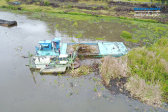 Watermaster restoring the eutrophic Lake Fuquene by removing nutrient pollution and excess vegetation in Colombia