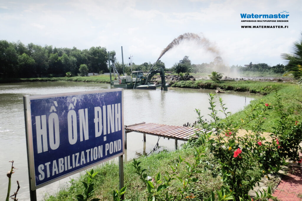 Stabilization pond maintenance work at a water purification plant in Vietnam